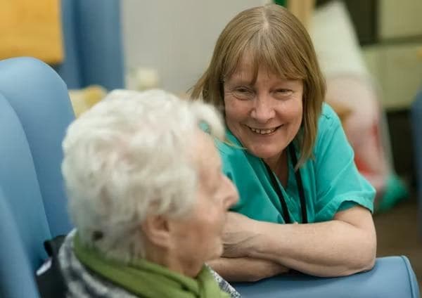 Care worker sharing a moment with a resident