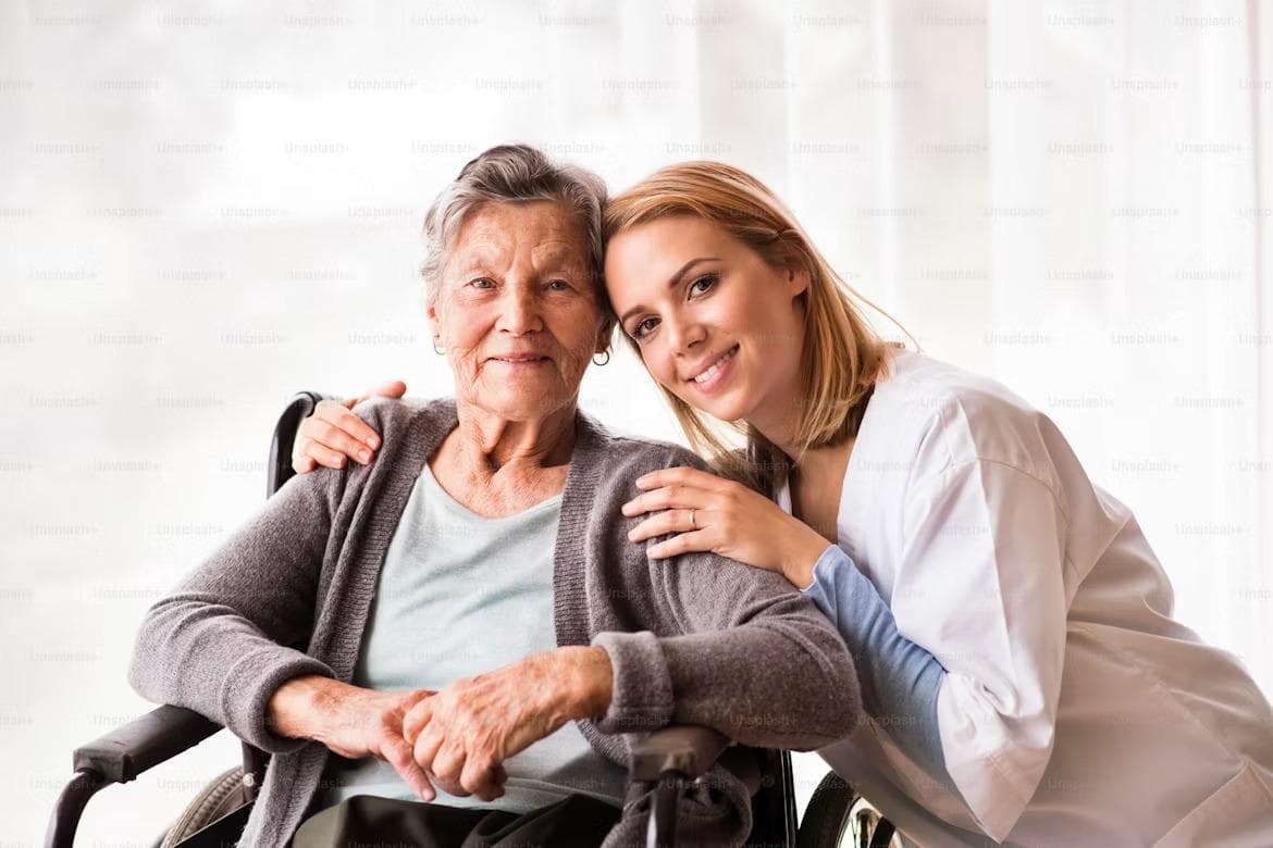 Care professional with a resident seated in a wheelchair